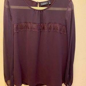 Burgundy sheer blouse.
